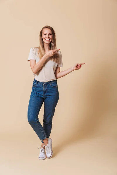 Full Length Portrait Happy Casual Girl Pointing Finger Away Copy — Stock Photo, Image