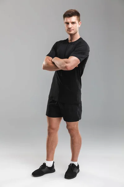 Full Length Portrait Confident Young Sportsman Standing Arms Folded Isolated — Stock Photo, Image