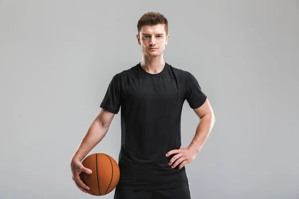 Portrait Concentrated Young Sportsman Holding Basketball Isolated Gray Background — Stok Foto