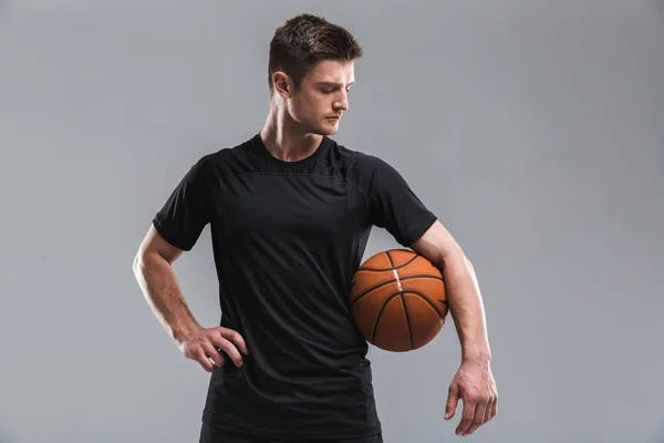 Portrait Concentrated Young Sportsman Standing Basketball Isolated Gray Background — Stok Foto