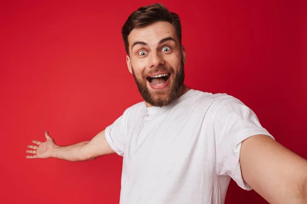 Picture Emotional Excited Young Handsome Man Standing Isolated Red Wall — Stock Photo, Image