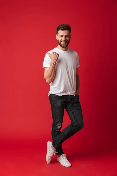 Image Handsome Young Emotional Man Standing Isolated Red Wall Background — Stock Photo, Image