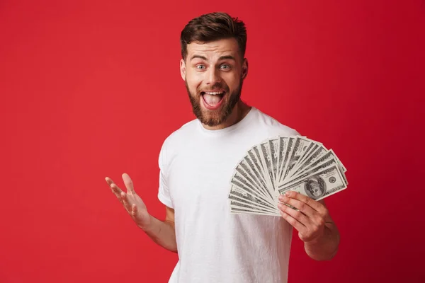 Image Excited Screaming Young Man Isolated Red Wall Background Holding — Stock Photo, Image