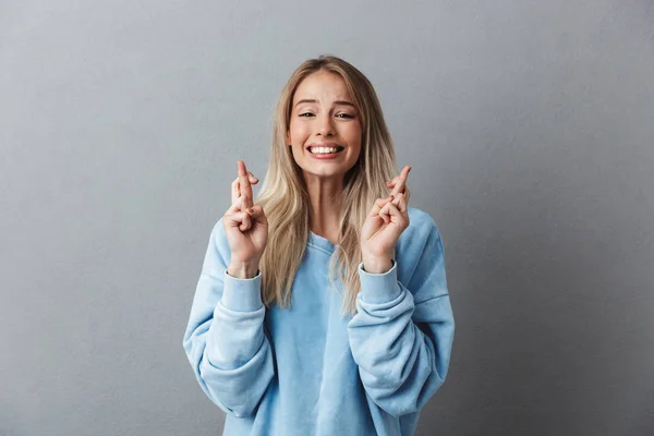 Portrait Excited Young Girl Blue Sweatshirt Holding Fingers Crossed Good — Stock Photo, Image