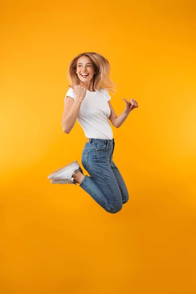 Full Length Portrait Cheerful Young Blonde Girl Pointing Away While — Stock Photo, Image