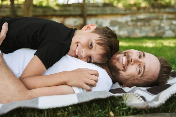 Image Happy Young Father Lies His Little Son Outdoors Park — Stock Photo, Image