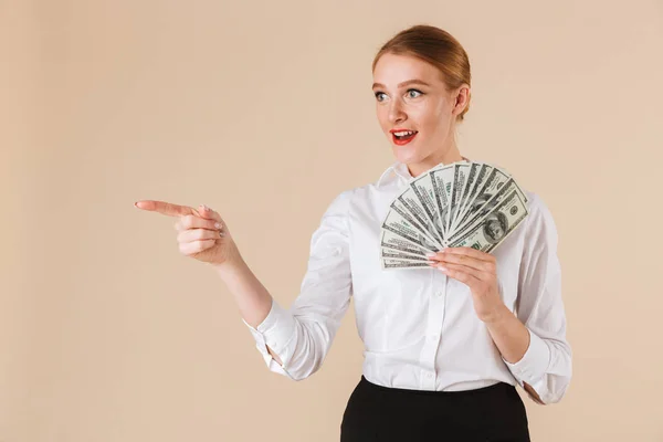 Portrait Smiling Businesswoman Showing Money Banknotes Pointing Finger Copy Space — Stock Photo, Image