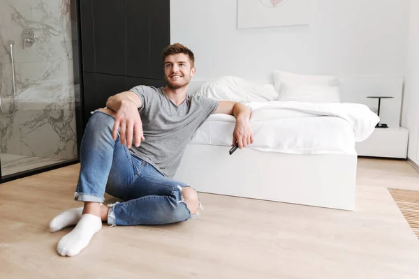 Satisfied Young Man Sitting Remote His Bedroom — Stock Photo, Image