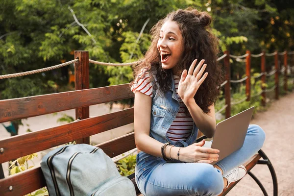 Photo Young Surprised Woman 20S Curly Hair Waving Hand Aside — Stock Photo, Image