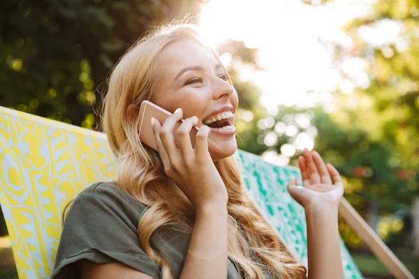 Side View Laughing Blonde Woman Dress Sitting Sun Lounger Talking — Stock Photo, Image