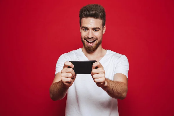 Mutlu Bir Genç Sakallı Adamın Üstünde Hareket Eden Telefon Izole — Stok fotoğraf