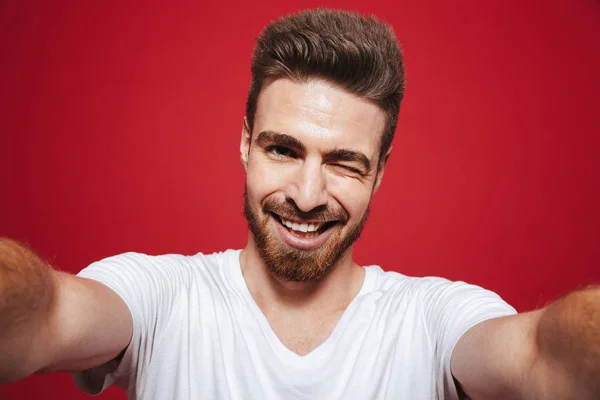 Portrait Cheerful Young Bearded Man Winking While Taking Selfie Isolated — Stock Photo, Image