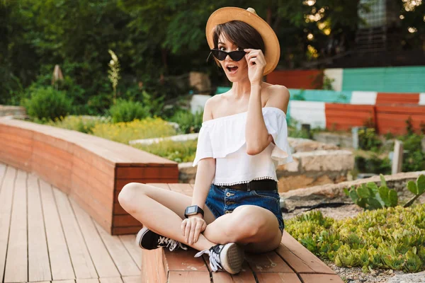 Cheerful Young Girl Dressed Summer Clothes Sunglasses Sitting Park — Stock Photo, Image