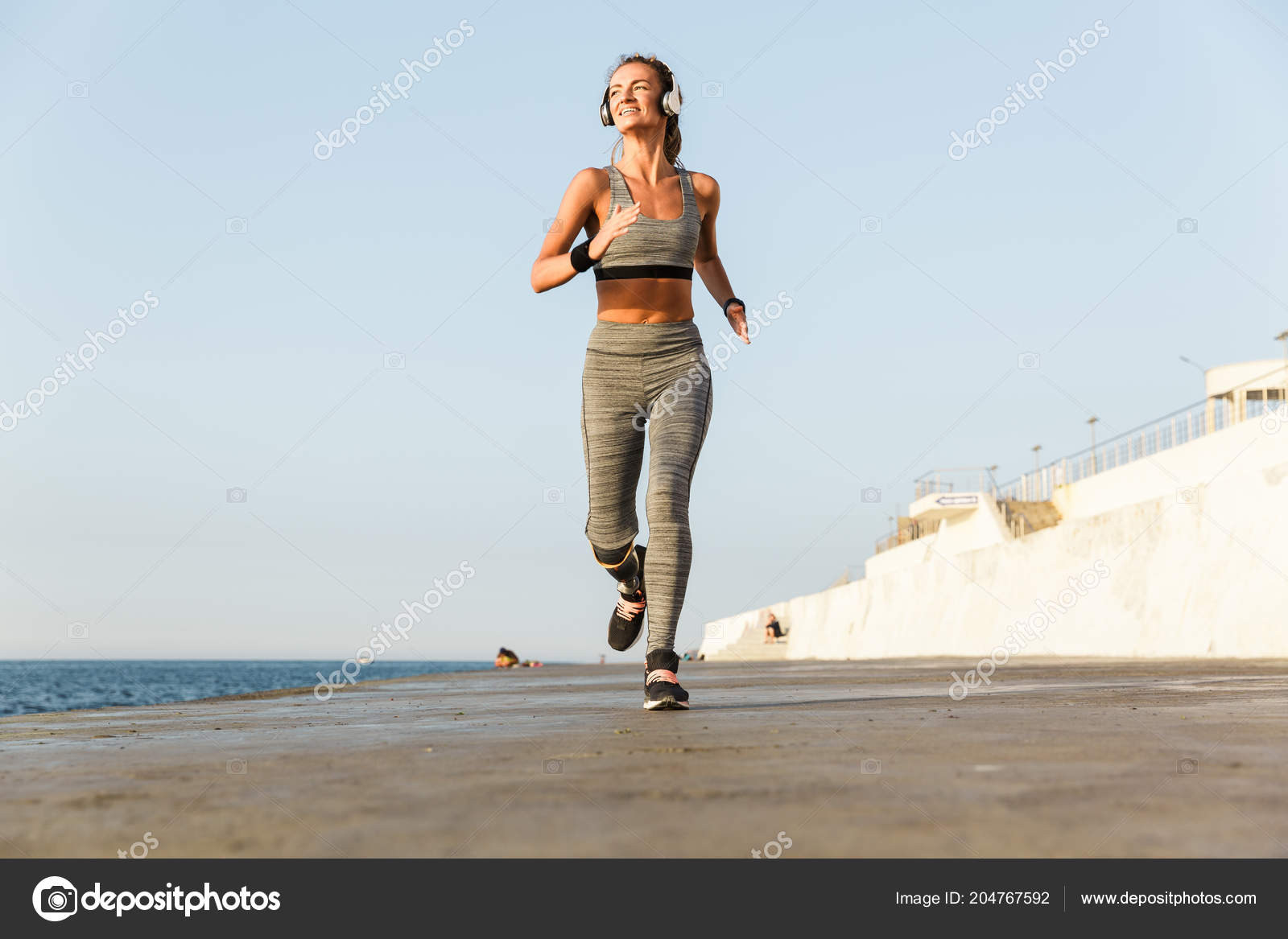 Attractive disabled athlete woman with prosthetic leg Stock Photo by  vadymvdrobot