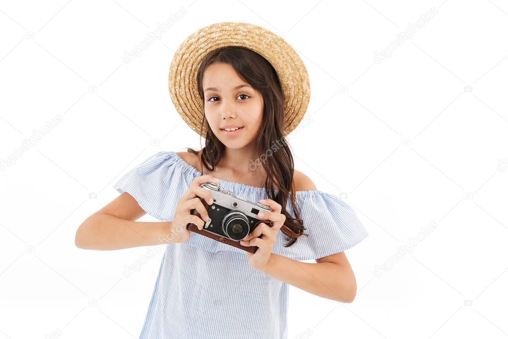Image of cute girl tourist photographer isolated over white wall background holding camera.
