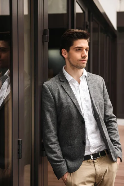 Serious Young Businessman Standing Glass Doors Outdoors — Stock Photo, Image