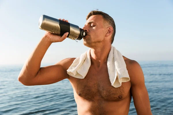 Picture Handsome Mature Sportsman Towel Standing Bottle Water Drinking Beach — Stock Photo, Image