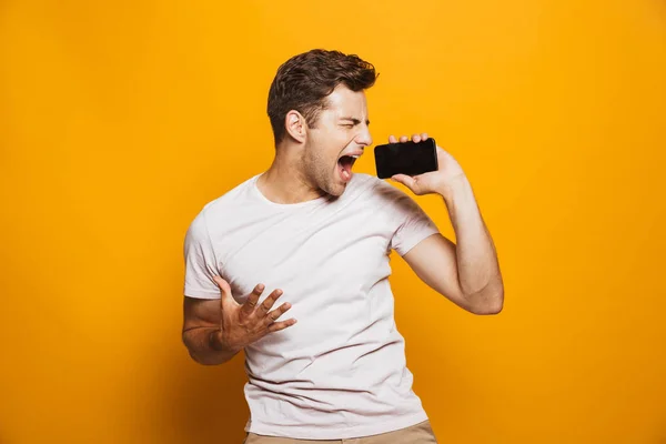 Portrait Excited Young Man Screaming Blank Screen Mobile Phone Isolated — Stock Photo, Image