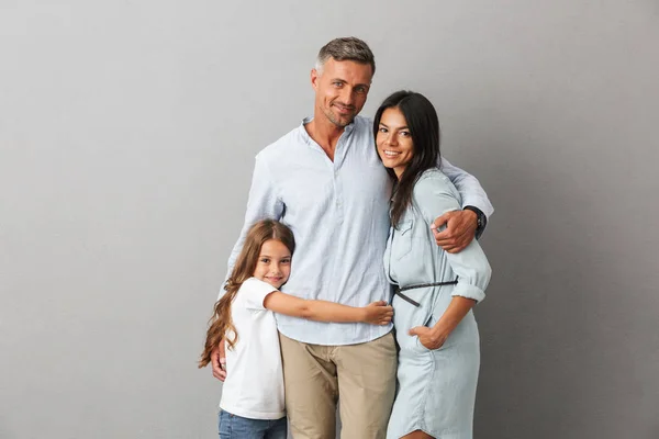 Portrait Happy Family Father Mother Little Daughter Hugging Isolated Gray — Stock Photo, Image