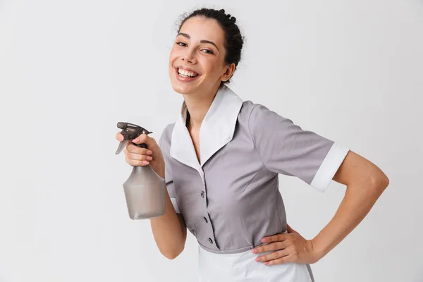 Portrait Happy Young Housemaid Dressed Uniform Using Bottle Sprayer Isolated — Stock Photo, Image