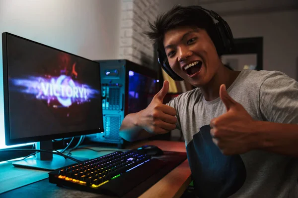 Young Asian Gamer Boy Rejoicing Victory While Playing Video Games — Stock Photo, Image