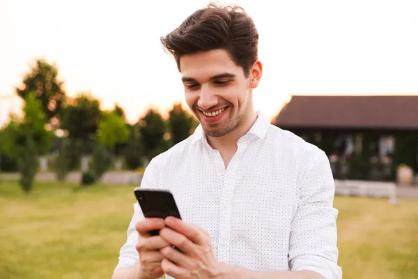 Image Happy Young Man Wearing White Shirt Smiling Using Black — Stock Photo, Image