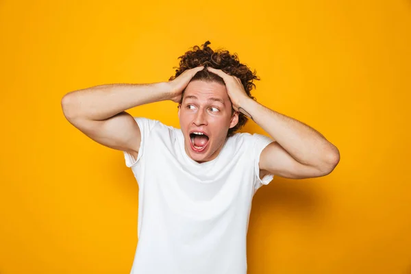 Portrait Frightened Young Man Curly Brown Hair Screaming Grabbing Head — Stock Photo, Image