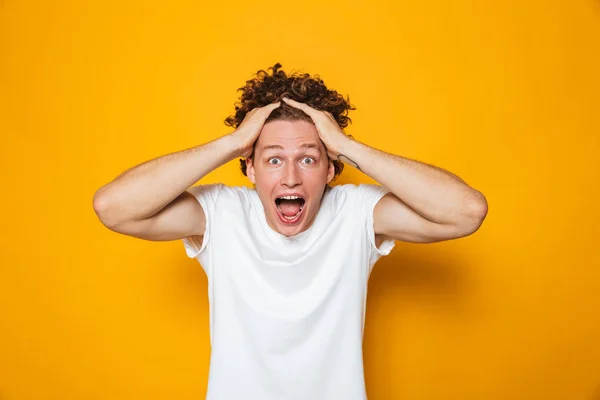Portrait Emotional Shocked Guy Curly Brown Hair Screaming Grabbing Head — Stock Photo, Image