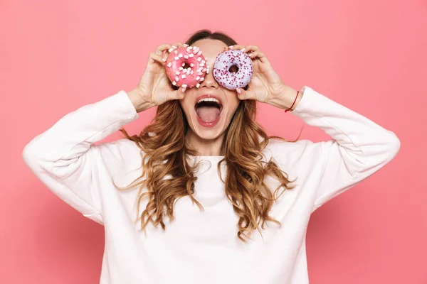 Portrait Happy Young Woman Showing Donuts Her Face Isolated Pink — Stock Photo, Image
