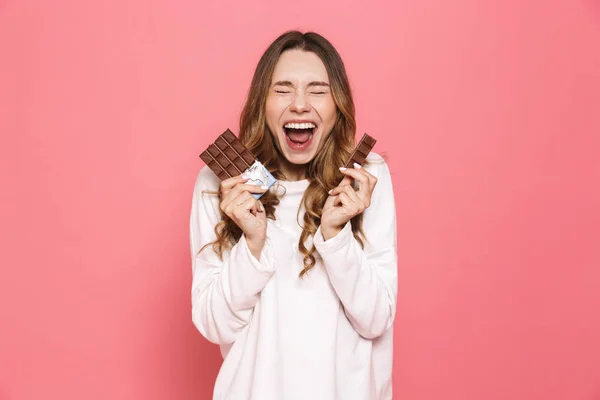 Portrait Delighted Young Woman Holding Chocolate Bar Isolated Pink Background — Stock Photo, Image