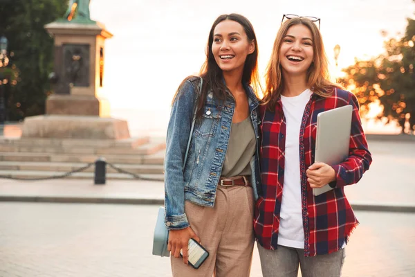 Two Cheerful Young Girls Friends Standing Together City Street Holding — Stock Photo, Image