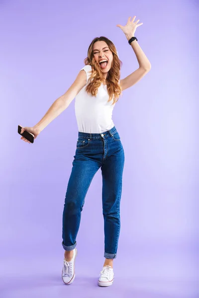 Full Length Portrait Energetic Young Girl Holding Mobile Phone Isolated — Stock Photo, Image