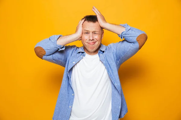 Portrait Annoyed Middle Aged Man Suffering Headache Isolated Yellow Background — Stock Photo, Image