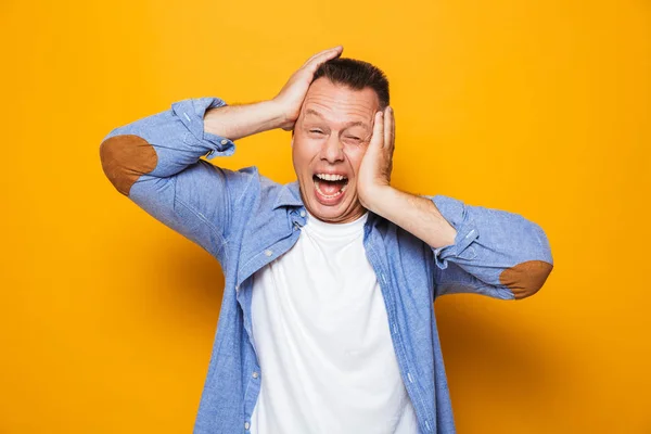 Portrait Annoyed Middle Aged Man Suffering Migraine Isolated Yellow Background — Stock Photo, Image