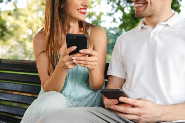 Cropped Image Young Cute Loving Couple Sitting Outdoors While Using — Stock Photo, Image