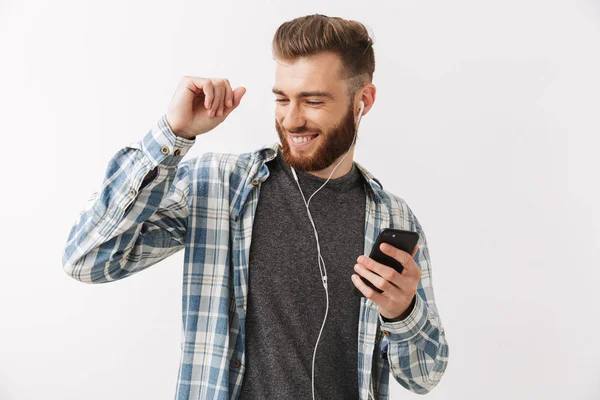 Portrait Happy Young Bearded Man Standing Isolated White Listening Music — Stock Photo, Image