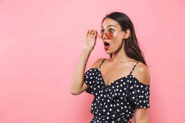 Surprised Brunette Woman Dress Take Sunglasses Looking Away Pink Background — Stock Photo, Image