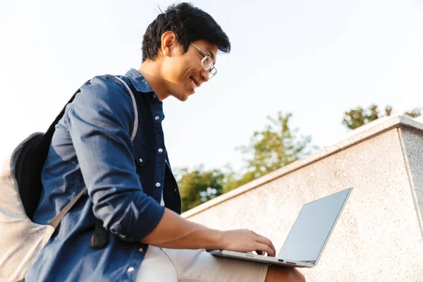 Low Angle Smiling Asian Man Student Backpack Using Laptop Computer — Stock Photo, Image