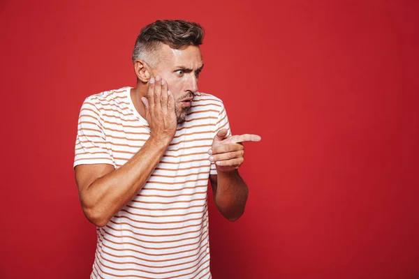 Portrait Caucasian Adult Man Grabbing His Face Pointing Finger Aside — Stock Photo, Image