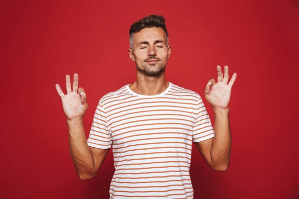 Attractive Man Striped Shirt Gesturing Sign Closed Eyes Isolated Red — Stock Photo, Image