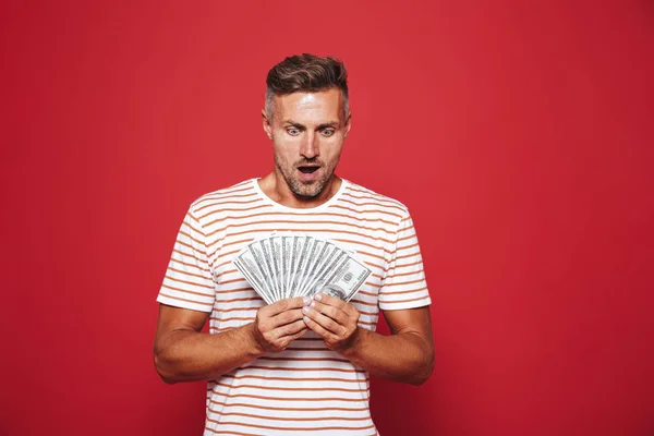 Portrait Excited Man Standing Red Background Holding Money Banknotes — Stock Photo, Image