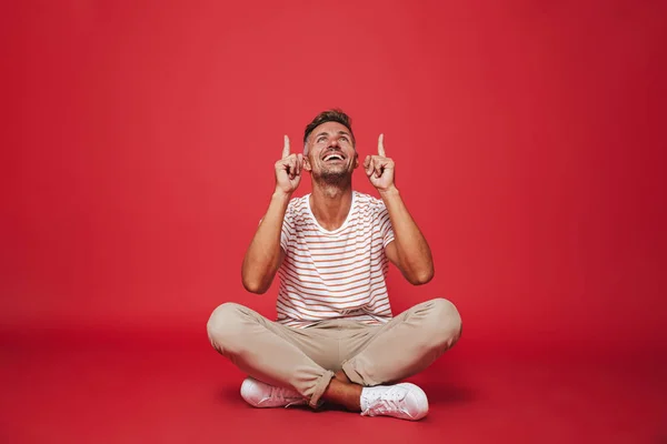 Image Joyful Man 30S Striped Shirt Pointing Fingers Upward While — Stock Photo, Image