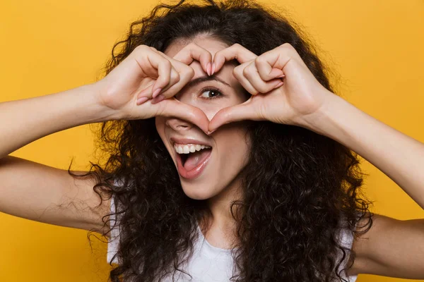 Photo Caucasian Woman 20S Curly Hair Smiling Showing Heart Shape — Stock Photo, Image