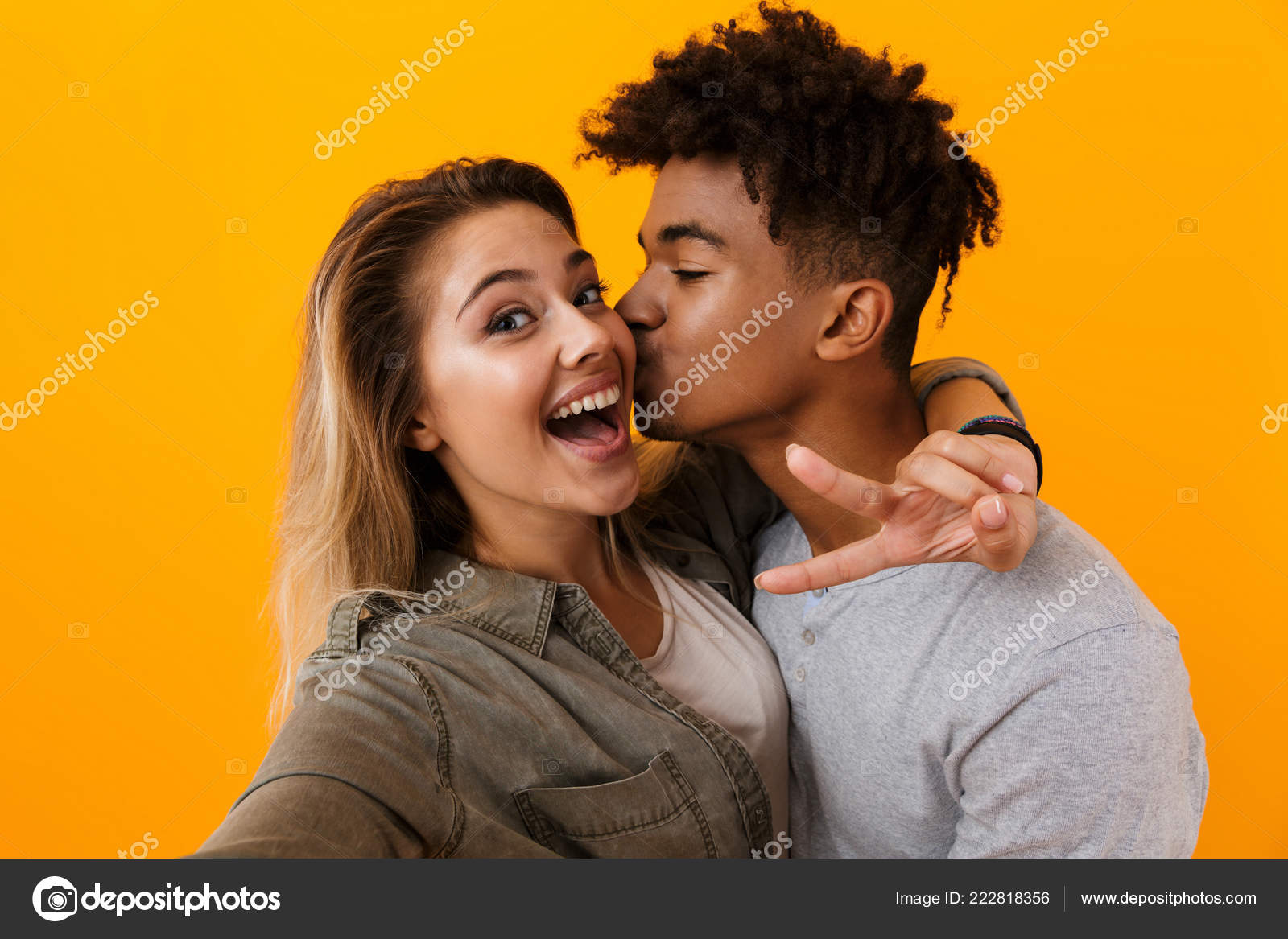 Image Of Happy Cute Young Loving Couple Posing Isolated Over Yellow  Background Hugging Take A Selfie By Camera Showing Thumbs Up Gesture. Stock  Photo, Picture and Royalty Free Image. Image 110979077.