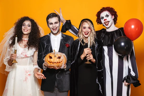 Group Cheerful Dressed Scary Costumes Celebrating Halloween Isolated Yellow Background — Stock Photo, Image
