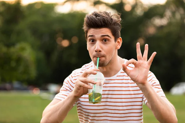 Image European Man 20S Walking Green Park Drinking Beverage Plastic — Stock Photo, Image