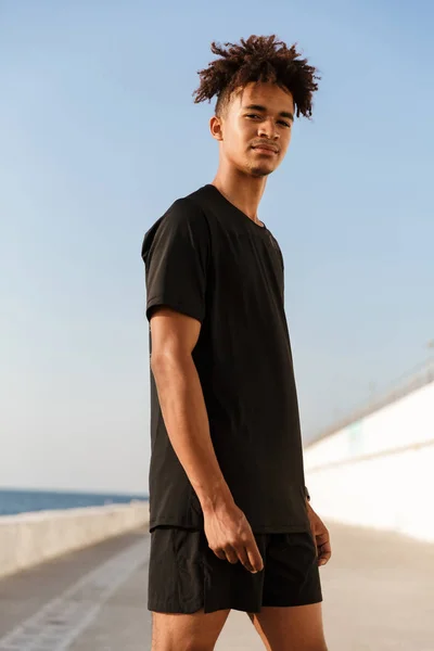 Strong Young African Teenager Dressed Sportswear Standing Beach Looking Camera — Stock Photo, Image