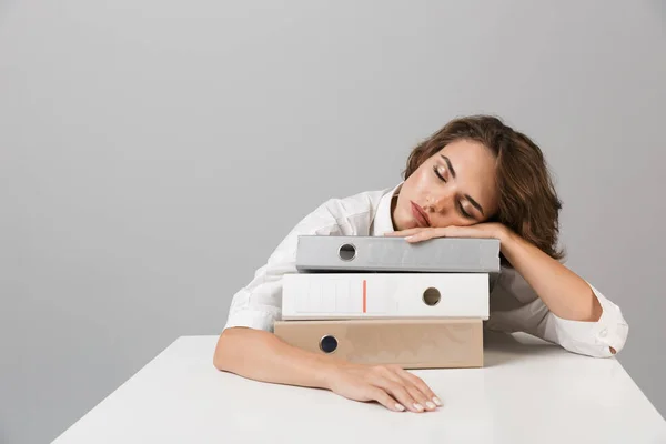 Photo Bored Tired Young Woman Sitting Table Isolated Grey Background — Stock Photo, Image