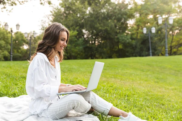 Joyful Young Woman Spending Time Park Sitting Grass Using Laptop — Stock Photo, Image