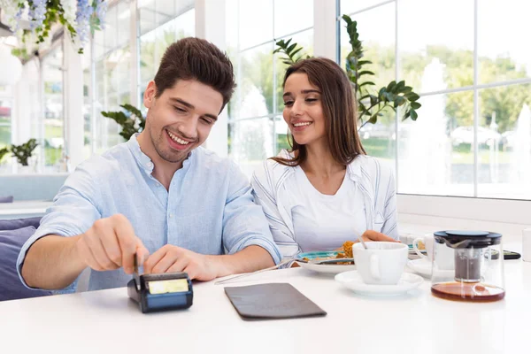 Image Young Happy Loving Couple Sitting Cafe Holding Credit Card — Stock Photo, Image
